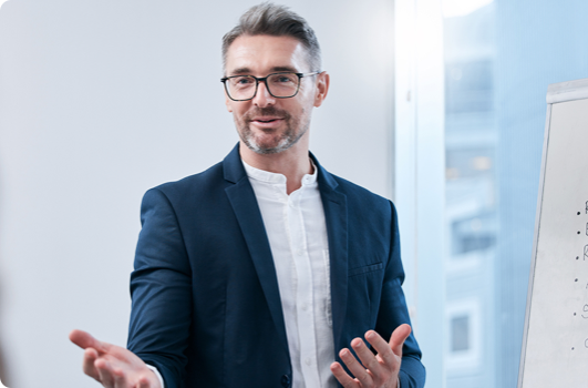 Man in a suit holding a meeting and talking